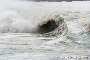 Waimea Shorebreak. Black hole in a white ocean.